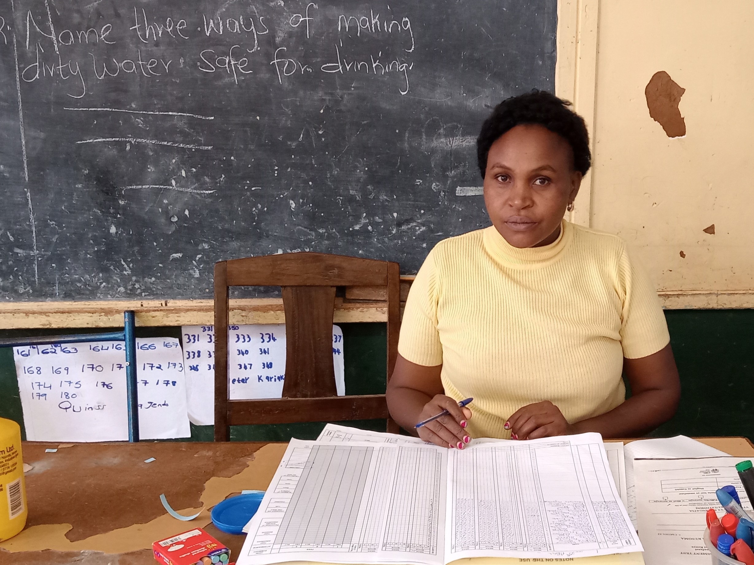 A teacher scaling her academic ladder amid reports of a high ECDE attendance rate among learners